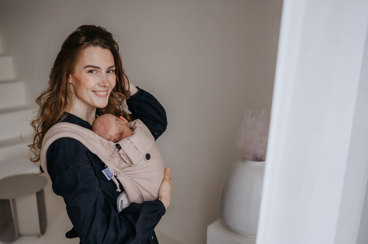 Waarom is het dragen goed voor mijn baby in een draagdoek of draagzak?